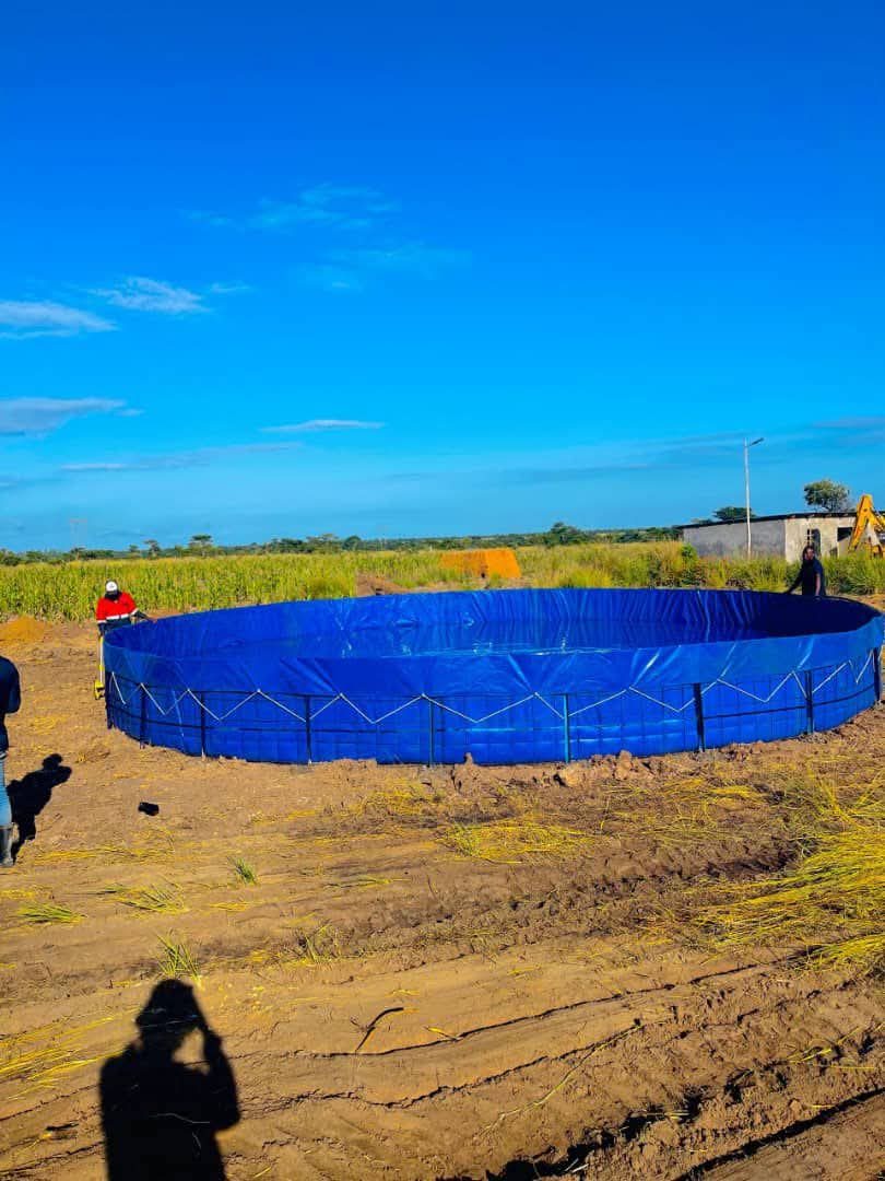 Large lined water storage reservoir installed in a field