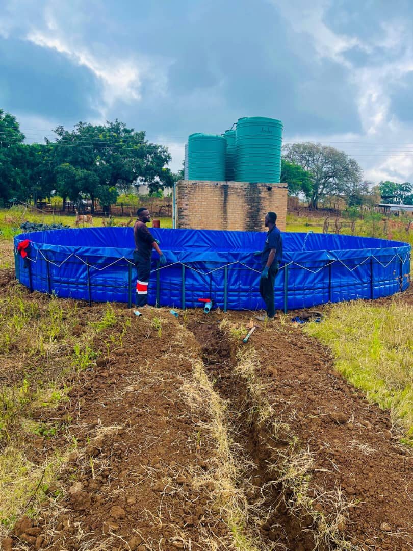 Irrigation Masters team installing a lined storage reservoir and water tanks on a farm in Zimbabwe